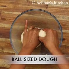 someone is kneading an uncooked dough in a bowl with the words ball sized dough