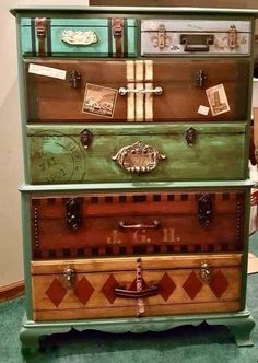 an old dresser is painted green and brown