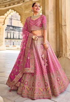 Banarasi silk circular lehenga choli in Magenta colour 118  Desc:  Style : Circular Lehenga Choli Color : Magenta Fabric : Banarasi Silk Work : Embroidery Wash Care : Dry clean Sleeve Style : Half Sleeve Long Sleeves : Done only in Custom Stitch Sleeves Lining : Done only in Custom Stitch Bust Size : 32 to 42 Inches Occasion : Wedding   Mehendi   Sangeet   Engagement   Reception   Baby Shower. With Express Free Shipping and Custom Stitching, Buy Indian Party wedding wear bridal Lehenga Banarasi Pink Bridal Lehenga, Latest Bridal Lehenga Designs, Blouse Lehenga, Bridal Lehenga Designs, Latest Bridal Lehenga, Raw Silk Lehenga, Wedding Lehenga Designs, Bridal Lehenga Red, Gaun Fashion