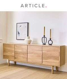 a wooden sideboard with two vases sitting on it's top and the words article above it