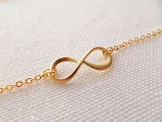 So sweet and adorable, you would want to wear it everyday!CHOOSE your length 15-18 inches.Fast shipping within 1-3 daysComes in a Gift Box . Ready for your special presentation-Matte gold plated infinity charm 21*8.5 mm-Gold plated chain -Lobster clasp. Please read the store policy before purchasewww.etsy.com/shop/TiffanyAvenueBridal/policy?ref=shopinfo_policies_leftnavThank you! ♥ Infinity Necklace With Delicate Chain For Wedding, Dainty Infinity Necklace For Wedding, Dainty Gold Infinity Necklace, Simple Gold Necklace For Bridesmaid Gift, Adjustable Gold Necklaces For Wedding Gift, Minimalist Infinity Necklace For Wedding, Adjustable Infinity Necklace For Wedding, Delicate Infinity Chain Wedding Jewelry, Dainty Infinity Jewelry For Bridesmaid Gift