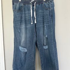 Mid Rise. Wide Leg. Size 16. Soft, Lightweight Denim. Destroyed Look. Drawstring Waist. Never Worn, Took Tags Off And Too Big. Casual Distressed Dark Wash Pants, Casual Medium Wash Distressed Pants, Relaxed Fit Ripped Denim Pants, Casual Relaxed Fit Ripped Jeans, Casual Dark Wash Ripped Pants, Casual Distressed Denim Blue Bottoms, Casual Medium Wash Pants With Frayed Hem, Light Wash Casual Pants With Frayed Hem, Casual Pants With Frayed Hem In Medium Wash