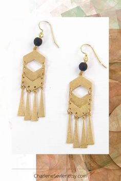 Get ready to turn heads with these bold, daring, and oh-so-chic long geometric gold and black chandelier earrings. Perfect for adding a touch of elegance and edge to any outfit, these earrings will have you feeling like a true fashionista! Gold And Black Chandelier, Glam Jewelry, Chevron Earrings, Gold Chandelier Earrings, Boho Fringe, Boho Glam, Jewelry Showcases, Black Chevron, Newport News