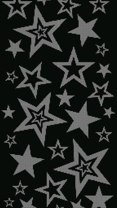 a black and white pattern with stars on the bottom, in different sizes and colors