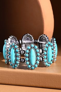 This Navajo Western Natural Stone Stretch Bracelet is a fashionable accessory for everyone's jewelry box! It features beautiful stones in a modern style bracelet design to add some serious bling to your evening wardrobe. Come on, rock this bracelet! *APPROX. L 8.25" Diameter 2.5" Turquoise Bohemian Bangle Crystal Bracelet, Turquoise Bohemian Crystal Bracelet, Adjustable Metal Bracelets With Stones, Trendy Turquoise Metal Bracelets, Bohemian Stretch Bracelet With Natural Stones, Turquoise Bracelet Jewelry, Turquoise Bracelet Fashion Accessory, Trendy Turquoise Bangle Jewelry, Bohemian Turquoise Stone Bracelet