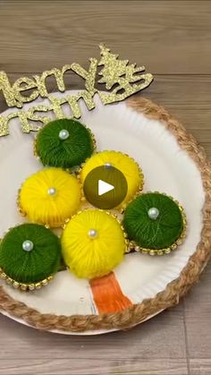 a white plate topped with yellow and green decorations