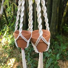 two plant hangers made out of clay pots and twine ropes with text overlay reading diy macrame plant hanger