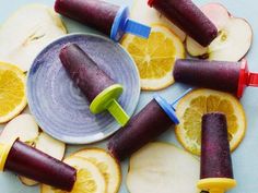 an assortment of fruit popsicles on a plate