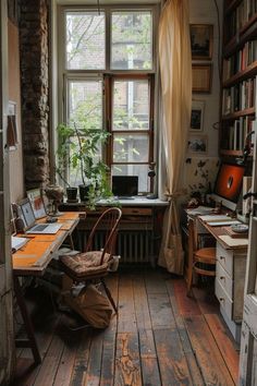 a room with wooden floors and lots of books on the shelves in front of a window