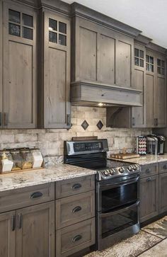 a kitchen with granite counter tops and wooden cabinets