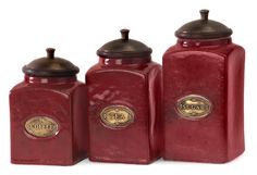 three red canisters with gold accents and lids