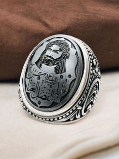 Islamic Arabic Carving Natural Hadid sini Hematite Hz Abbas, 925 silver Ring,Shia,Ahlulbeyt ابو الفضل العباس Stone size is 15x20mm Back of ring is open to touch the stone Islamic Scraping,Islamic Men's Ring,Islamic Carving,Islamic Gift for Men,Islamic Unique Gift,Islamic Ring Gift,Silver Men's Ring Handmade Silver Ring,Father's Day Gift,Best Gift for Man,Gift for Muslim Men,Gifts for Boyfriend,Gifts for Dad,Gifts for Girlfriend,Gifts for Husband,Gifts for Mom,Gifts for Sister,Gifts for Wife,Anni Islamic Ring, Father Christmas Gifts, Muslim Men, Signet Rings, Islamic Gifts, Mens Silver Rings, Gifts For Sister, 925 Silver Ring, Silver Rings Handmade