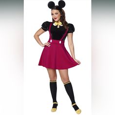 a woman dressed in mickey mouse costume posing for a photo with her hands on her hips