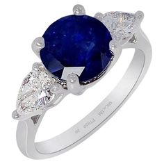 New Platinum custom natural Ceylon sapphire ring containing a round cut natural blue sapphire measuring 7.79 x 7.88 x 5.94 mm weighing 3.05 carat. Type II. medium-dark, strong, blue color GIA B 6/5, set with 2 pear-cut diamonds with a weight 0.30 ct's each VS-2 clarity, E color. Please see the videos & GIA sapphire & diamond reports shown with the pictures. This is a classic 3 stone natural sapphire ring set with a 3.05 ct bright blue round cut sapphire set with two GIA certified pear cut diamonds at each side with outstanding brilliance creating this stunning custom ring platinum 3 stone ring setting. This custom sapphire ring would be a perfect choice for both engagement ring or special anniversary gift, please contact us with any questions, our office is open every day and are always ha Platinum Sapphire Ring, Royal Engagement Rings, Ceylon Sapphire Ring, Platinum Diamond Rings, 3 Stone Rings, Ceylon Sapphire, Pear Cut Diamond, Sapphire Engagement Ring Blue, Sapphire Diamond Ring