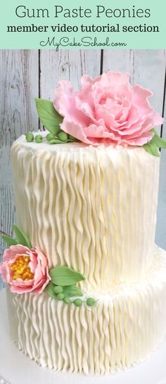 there is a white cake with pink flowers on it and the words gum paste peonies