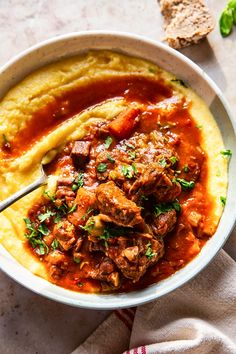 a bowl filled with meat and mashed potatoes