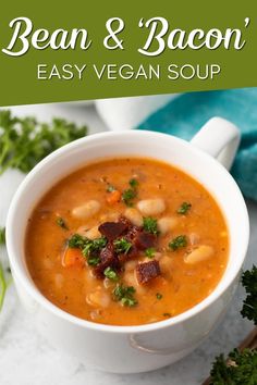 bean and bacon easy vegan soup in a white bowl with parsley on the side