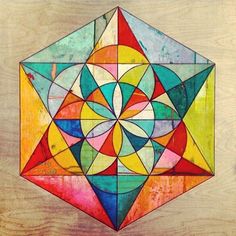 an image of a colorful geometric design on wood