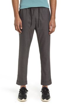 Topped with a comfy elastic waist, these versatile work-to-weekend pants feature a crisp houndstooth-plaid pattern that lends a smart, polished touch. 28 1/2" inseam; 14" leg opening; 11" front rise; 16 1/2" back rise (size Medium) Elastic/drawstring waist 70% polyester, 29% rayon, 1% spandex Machine wash, tumble dry Imported Men's Clothing Casual Pinstripe Ankle-length Pants, Casual Pinstripe Ankle-length Bottoms, Casual Pinstripe Pants For Work, Casual Striped Pants For Business Casual, Casual Pinstripe Tapered Leg Bottoms, Striped Bottoms For Business Casual Fall Season, Fall Season Striped Bottoms For Business Casual, Casual Pinstripe Pants With Welt Pockets, Casual Striped Pants With Welt Pockets