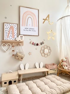 a child's room with toys and decor on the wall, including a bed