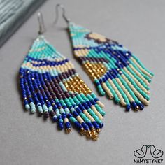 These abstract turquoise beaded earrings are made of high-quality Czech beads and strong synthetic thread. They are elegant, fashionable, and highly versatile, suitable for everyday wear. Features: Sterling silver components Color: blue, turquoise, gold, purple, beige. This item is currently in stock. More beaded earrings http://etsy.me/2ycItdb Gerdan necklaces http://etsy.me/2mihf0J Beaded necklaces http://etsy.me/2Dkf1Fo Crochet necklaces http://etsy.me/2CAPdFc Back to shop https://www.etsy.co Turquoise Tassel Earrings With Colorful Beads For Festival, Turquoise Beaded Drop Earrings For Festival, Turquoise Chandelier Earrings With Colorful Round Beads, Festival Turquoise Tassel Earrings With Colorful Beads, Turquoise Beaded Earrings For Festivals, Festival Turquoise Beaded Earrings With Colorful Beads, Turquoise Beaded Tassel Earrings For Festival, Turquoise Beaded Chandelier Earrings With Round Beads, Festival Blue Chandelier Earrings With Colorful Beads