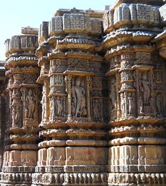 an intricately carved stone wall with carvings on it