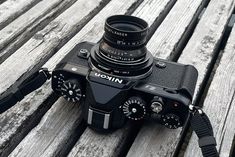 a camera sitting on top of a wooden bench