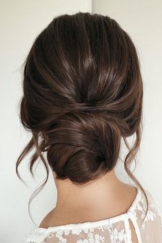 Updo Loose Curls Low Buns, Loose Wedding Bun Hair, Low Wispy Bun Wedding, Low Piecey Bun, Wedding Updo Brunette Classy, Low Pinned Hair Wedding Updo, Bridal Low Bun Dark Hair, Dark Hair Formal Hairstyles, Bridal Hair Simple Bun