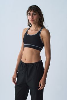 Our Organic Cotton Sport Bra provides full coverage, comfort and support for all activities. Finished with a racer back and 1 1/4 inch encased elastic hem. The Organic Cotton Sport Bra is manufactured in New York City. Fit notes – The Organic Cotton Sport Bra fits true to size, we recommend to take your normal size in a bra or sports bra style. Please follow measurements below to understand sizing. All measurements are in inches before stretch. Recommended Bra Sizing Across Chest Lying Flat (Pit T-back Sports Bra With Built-in Padding, Sporty Racerback Activewear With Built-in Padding, Racerback Activewear With Built-in Padding For Light Sports, Sporty T-back Activewear For Training, Sporty Micro-elastic Activewear For Light Sports, Functional T-back Activewear For Sports, Breathable T-back Sports Bra, Sporty Nylon T-back Sports Bra, Go-dry Stretch Sports Bra For Events