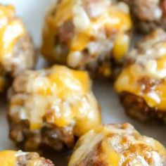 cheeseburger meatballs with melted cheese on top are ready to be eaten for lunch