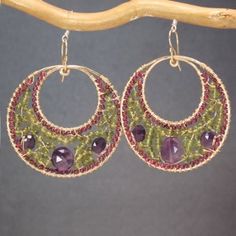 Hammered hoops rhodolite garnet, vessonite, and amethyst Bohemian 122 by CalicoJunoJewelry on Etsy https://www.etsy.com/listing/180852399/hammered-hoops-rhodolite-garnet Purple Multi-stone Bohemian Jewelry, Purple Bohemian Multi-stone Jewelry, Purple Fusion Style Round Jewelry, Handmade Green Amethyst Gemstones, Handmade Peridot Round Earrings, Handmade Round Peridot Earrings, Handmade Fine Jewelry Amethyst Gemstones, Handmade Fine Amethyst Gemstones, Handmade Amethyst Fine Jewelry