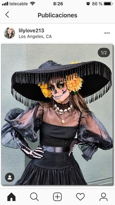 a woman in a black dress and large hat with flowers on her head is seen on instagram