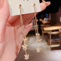 Very Lovely Golden Floral Tassel Earrings. These Earrings Are Unique, Gorgeous, And Very Creative. So Elegant With It's Long 18k Fill Chain, That Connect To Beautiful Golden Floral Leaves That Lays On Top Of A 7mm Stunning Sparkling Clear Crystals That Shine Remarkably, The Back Tassel Is Connected To A Butterfly Backing, Light Weight And Moves With You With Ease. Appox. 3" Long. Long Length Accentuates The Neck And Jawline Very Romantic Great For Any Occasion 100% Brand New And Boutique Gold-plated Flower Earrings For Party, Gold Plated Flower Earrings For Party, Gold Tassel Drop Earrings For Gifts, Gold Dangle Threader Earrings For Party, Gold Tassel Earrings With Latkans For Gift, Gift Flower Earrings With Latkans, Earring Long, Floral Leaves, Clear Crystals