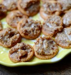 small pastries are sitting on a yellow and white plate