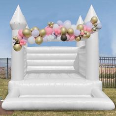 an inflatable arch decorated with balloons