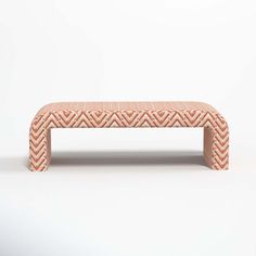 an orange and white bench sitting on top of a white floor