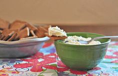 two bowls filled with food sitting on top of a table