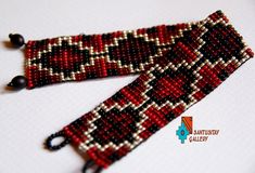 Stunning elegant beaded bracelet. Has been made on the loom from glass czech small beads in red, old gold and black. Dimensions: 19 cm x 3 cm Artisan Beaded Bracelets With Black Beads As Gift, Handmade Southwestern Black Beads, Artisan Black Beaded Bracelets As Gift, Artisan Beaded Bracelets With Black Beads For Gifts, Bohemian Black Handwoven Beaded Bracelets, Red Handwoven Bracelets For Festivals, Red Handwoven Festival Bracelets, Red Handwoven Beads For Jewelry Making, Red Bohemian Handwoven Bracelets