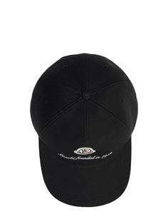 a black baseball cap with white embroidery on the front and side panel, sitting against a white background