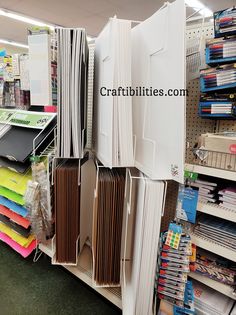 there are many files and folders on the shelves in this store, all stacked together