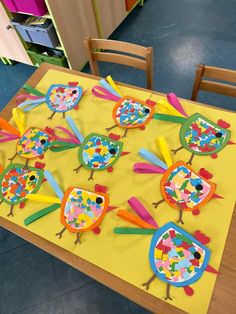 the table is decorated with colorful paper birds