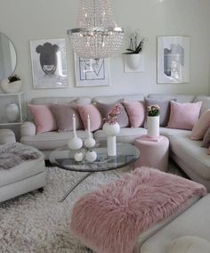 a living room filled with lots of furniture and decor on top of a white rug