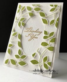 a white card with green leaves on it