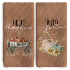 two towels with the words hello pumpkins and a wagon full of pumpkins on them