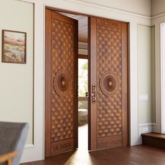 two wooden doors with intricate carvings on them