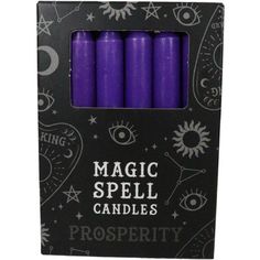 four purple candles in a black box with the words magic spell candles prosperity written on it