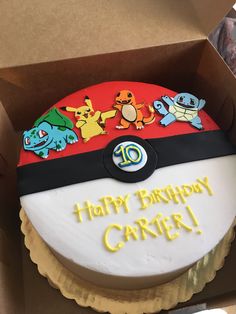 a birthday cake in a box with pokemon characters on it's top and the words happy birthday carrier