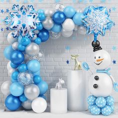 a snowman balloon arch with blue and white balloons