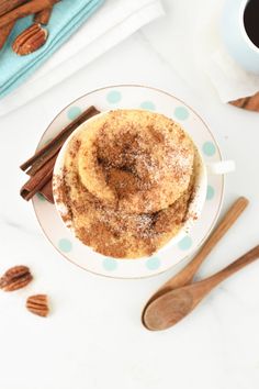 a cup of coffee with cinnamon and sugar on top