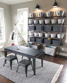 a living room filled with furniture and lots of storage